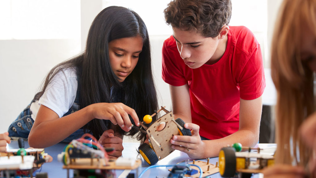 kids learning science education by building a robot car kit