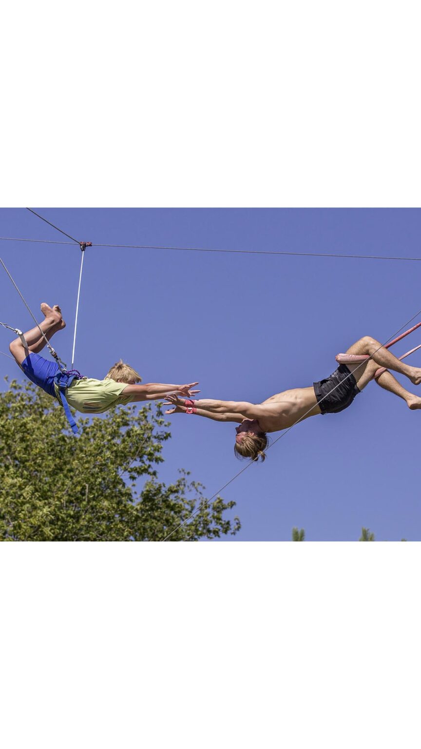 Flying Colors Trapeze images Summer Fun MN_0002_kidscircuscamp_flyingtrapeze_kneehang_catch - Sherri Mann